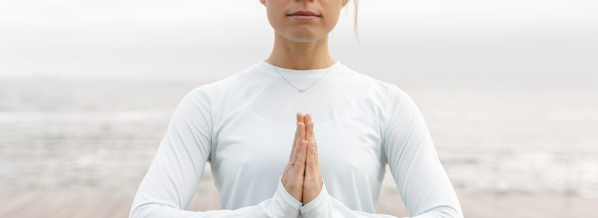 medium shot woman meditating