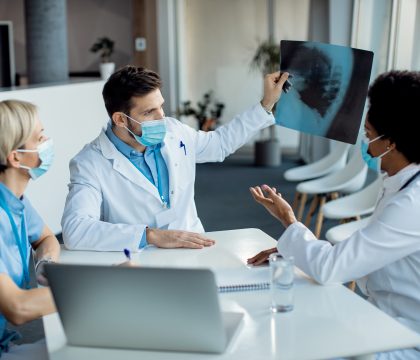 team healthcare experts examining xray image medical clinic